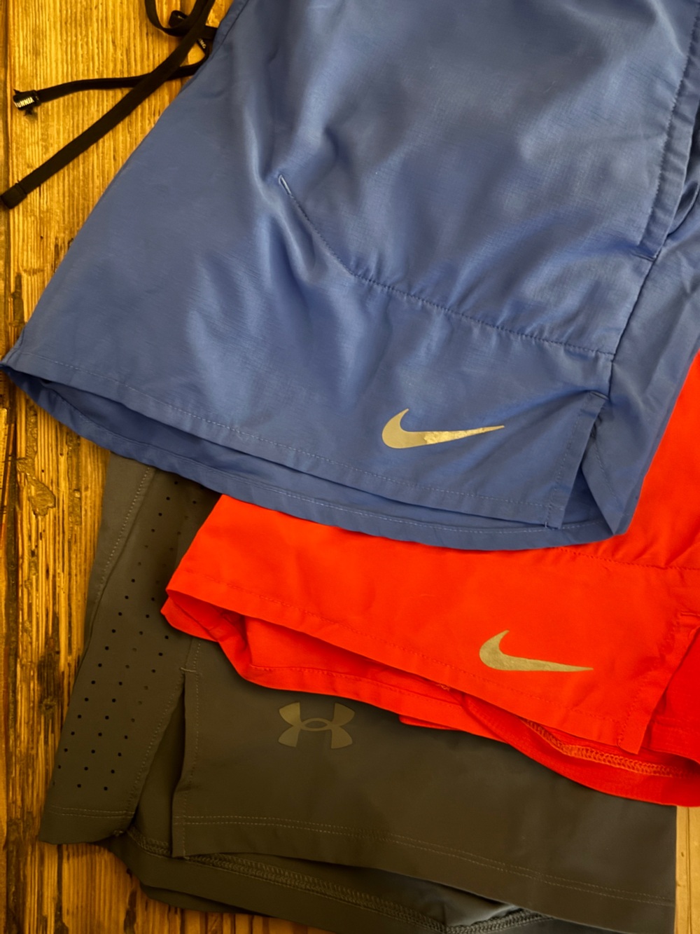 3 short bundle. Nike Men’s Blue and Red & Under Armor gray athletic shorts